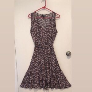 Sleeveless floral A-line with tiered ruffle for “wrap” effect